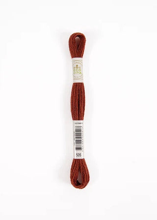 A single skein of wool DMC embroidery floss in a rust brown color, wrapped with a white paper label that shows the brand 'Miemö' and the color number '905', set against a plain white background.